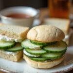 Close-up of a Downton Abbey tea sandwich filled with cucumber and cream cheese, highlighting the elegance of traditional British afternoon tea.