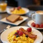Complete breakfast spread inspired by How I Met Your Mother at MacLaren's, featuring tasty scramble, bacon, and toast.