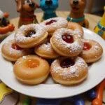 Delicious Scooby Doo jelly donuts filled with jelly and powdered sugar, artfully presented in a fun and colorful setting.