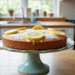 The Crown Lemon Drizzle Cake: a stunning final presentation of a moist, zesty cake, perfect for any occasion, highlighting its lemony goodness and glaze.
