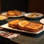 A stunning plate of Mandalorian Tatooine Toast served on a dining table, perfect for a Star Wars-inspired meal.