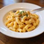 Delicious serving of The Office Mac and Cheese, showcasing the creamy texture and rich flavors, perfect for any office lunch.