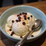 Delicious Attack on Titan Armin's Intellect Ice Cream served in a bowl, adorned with colorful sprinkles and chocolate chips.