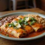 Delicious and vibrant Breaking Bad Tuco's Enchiladas served on a rustic wooden table with rice and beans, showcasing a mouth-watering dish.