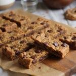 Final display of delicious homemade Charlie and the Chocolate Factory Golden Ticket Granola Bars on a wooden board.