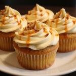 Final display of Harry Potter Butterbeer non-alcoholic Cupcakes with butterscotch frosting and caramel drizzle.