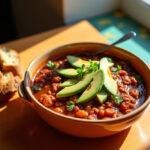 A beautifully presented bowl of Joker: Folie à Deux Lady Gaga's Harley Quinn's Hearty Chili, creating a delightful dining experience.