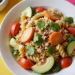 Delicious Lilo and Stitch Pleakley's Planet Perfect Pasta Salad perfectly plated, highlighting the vibrant colors and fresh ingredients, ready to be enjoyed.
