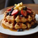 Finished Marvel Galactus' World-Devourer Waffles artfully displayed on a wooden table, topped with fresh fruit and syrup, ready to be served.