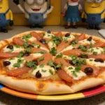 Delicious finished Minions Fart Blaster Flatbread Pizza presented on a colorful plate, ready to serve with vibrant toppings.