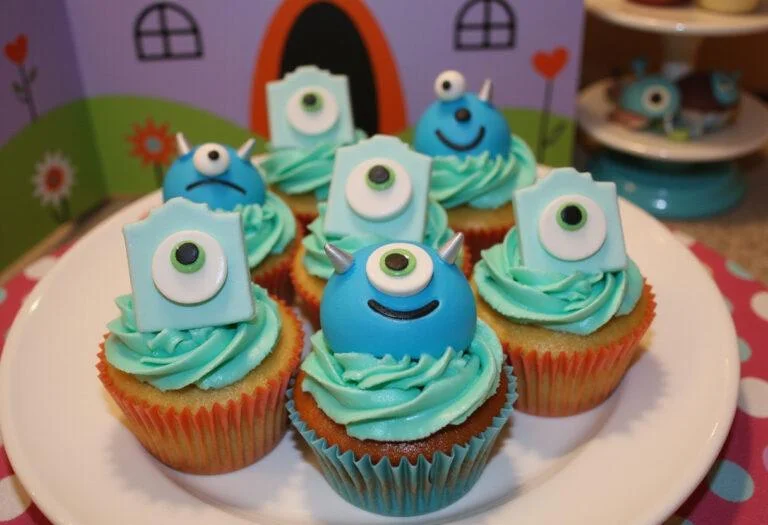 Final presentation of Monsters, Inc. Boo's Doorway Delight Cupcakes showcasing vibrant decorations and a joyful atmosphere.