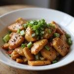 Serving a delicious bowl of Rush Chris Hemsworth's Champion Chicken Stir-fry, showcasing the vibrant colors and appetizing garnishes for an enticing meal.