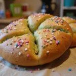Enjoying the final result of Shrek Fiona's Far Far Away Fairy Bread: a colorful, enchanting treat perfect for any fairy-tale gathering.