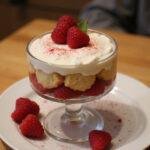 The finished product of The Chronicles of Narnia Lucy's cordial Raspberry Trifle, a stunning and delicious dessert ready to be enjoyed, perfect for any gathering.