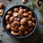 A bowl of The Lion King Scar's Shadowy Spiced Nuts, ready to be enjoyed, perfect for festive occasions or snacking.