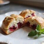 The perfect final result of The Princess Diaries Anne Hathaway's Royal Raspberry Scones showcasing a fluffy inside loaded with fresh raspberries.