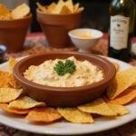 Final display of Toy Story Woody's Roundup Ranch Dip surrounded by crunchy tortilla chips on a themed table, perfect for serving guests.