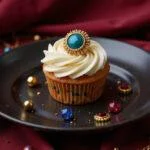 A realistic image of a Capitol Couture cupcake decorated with bold, colorful icing and intricate edible accessories, set on a luxurious plate with a themed backdrop inspired by Hunger Games Capitol fashion. The scene highlights dystopian elegance and fashion-forward dessert design.