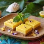 A realistic scene of Moana Lalotai Lagoon Lemon Bars displayed on a wooden tray with tropical decorations, set in a Polynesian-inspired outdoor setting with ocean views and colorful textiles, highlighting the vibrant dessert as a tropical Disney-inspired treat.